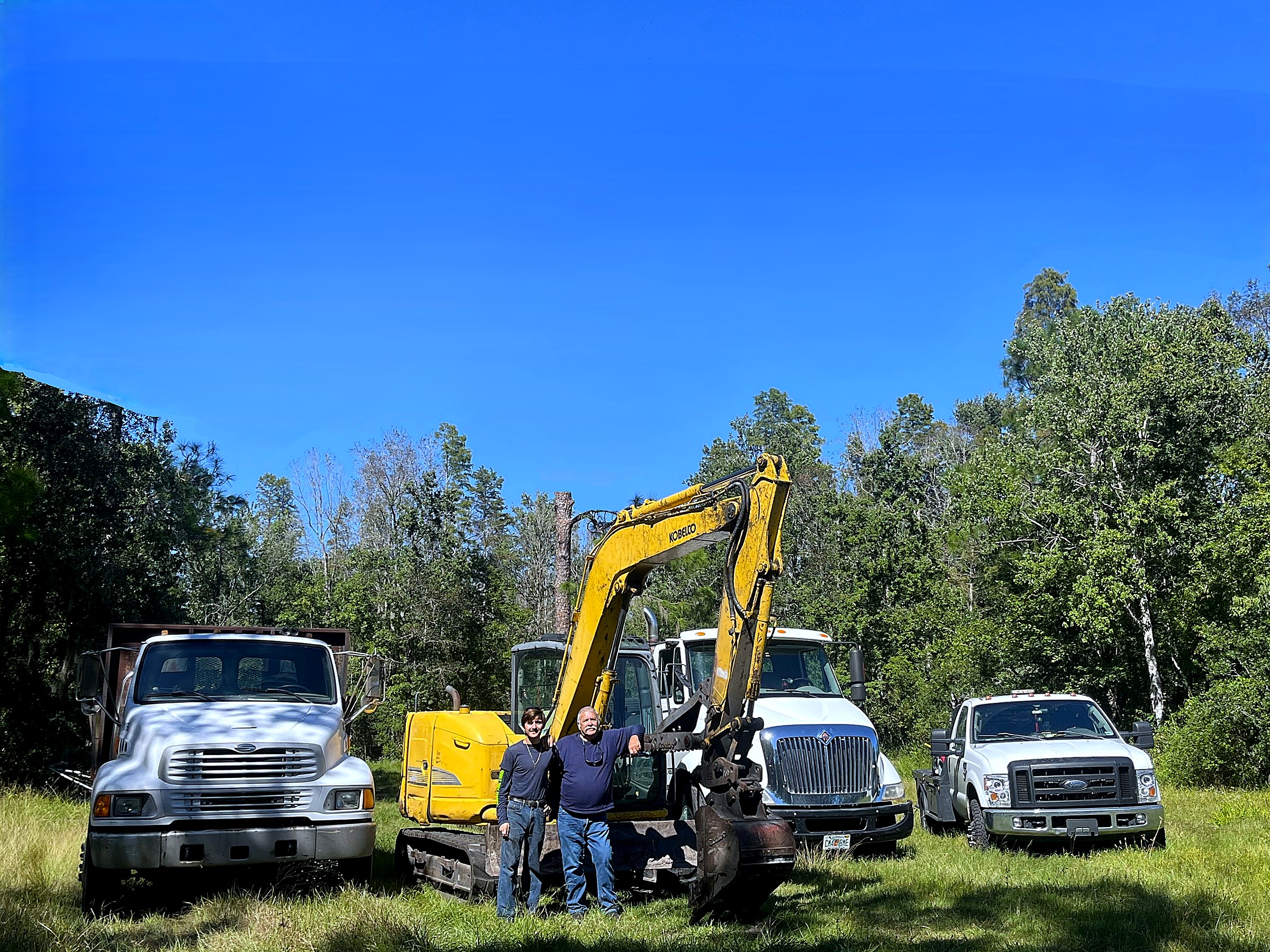 Breaking Ground Land Services and Demolition — Guy and Andrew with excavator and dump trucks