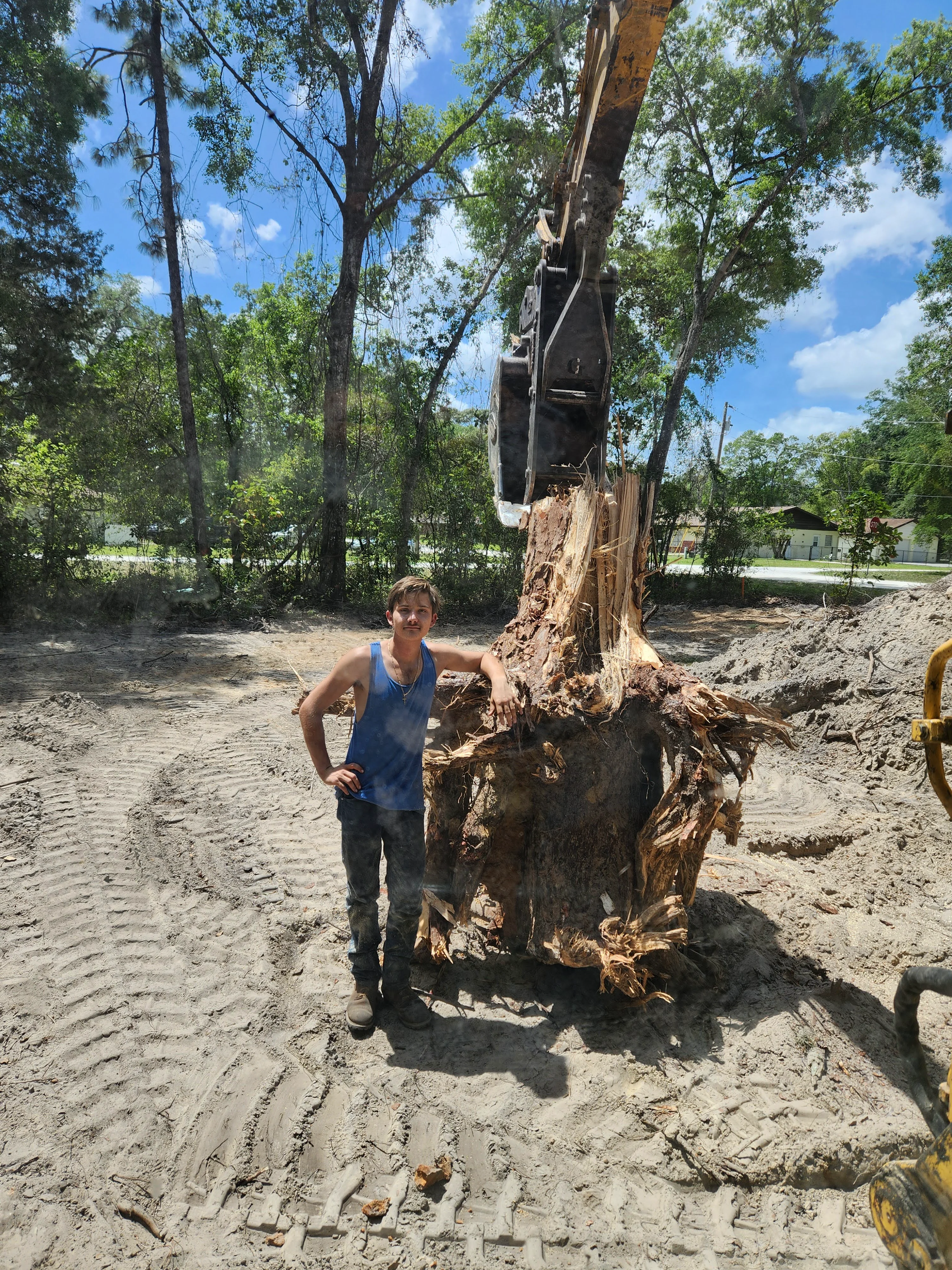 Guy Standing in Front of a Pine Stump